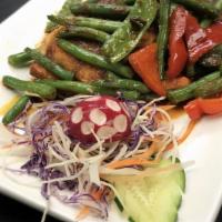 Tropical Salmon · Mild. Salmon fillet sautéed in spicy peking sauce with green bean, snow peas and bell pepper.