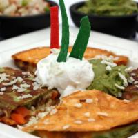 Ap: Grill Quesadilla · Locally made flavored flour tortilla filled with cheese blend, tomato, onion, and bell peppe...