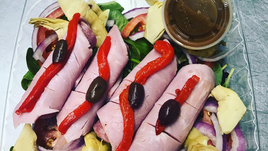 Antipasto Salad · Mixed greens, tomatoes, red onions, roasted red peppers, cucumbers, ham, Genoa salami, prosciutto, provolone slices with balsamic vinaigrette dressing.