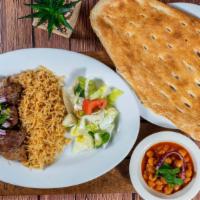 Lamb Kabob · Chunks of tender lamb, marinated in special spices, garlic and broiled on skewers over charc...