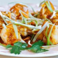 Imperial Shrimp · Lightly crisped jumbo shrimp in a tangy sauce with shredded snow pea pods, carrots and maita...