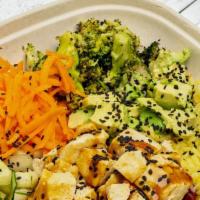 Teriyaki Tofu Plate · Yellow rice, broccoli, carrot, cucumber, black sesame seeds, avocado, and roasted tofu teriy...