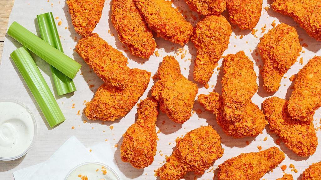 Double Crunch Bone-In Wings - Cheetos® Original · A mischievous twist on the traditional wing sauce with the original Cheetos® flavor you know and love. Tossed in sauce and coated in crunchy Cheetos® crumbles. Served with celery and house-made buttermilk ranch or Bleu cheese dressing.