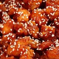 Sesame Chicken · Spring chicken cut into large chunks, marinated & quickly fried till crispy sautéed with red...
