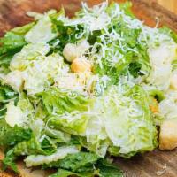 Classic Caesar · Roasted garlic dressing, lettuce, croutons and shaved Parmesan.