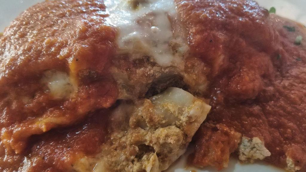 Lasagna · Homemade al forno (baked). Served with salad.