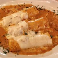 Manicotti · Homemade al forno (baked). Served with salad.