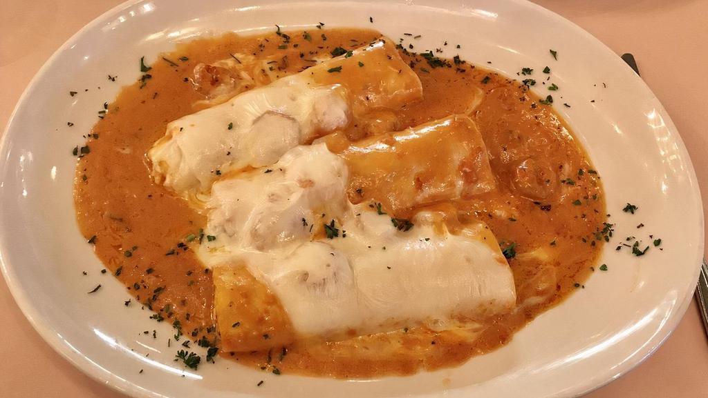 Manicotti · Homemade al forno (baked). Served with salad.