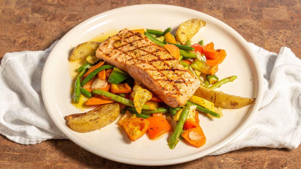 Grilled Salmon · Over mixed vegetables with a side of pasta.