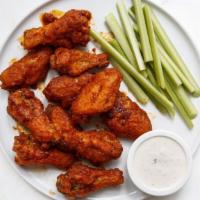 Chicken Wings · Buffalo, chipotle, sweet thai chili, jerk, or BBQ served with blue cheese dressing and celery.