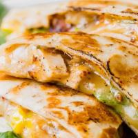 Chicken Quesadilla · Roasted pepitas, cheddar, and pepper jack cheese, cilantro, housemade salsa, sour cream.
sal...