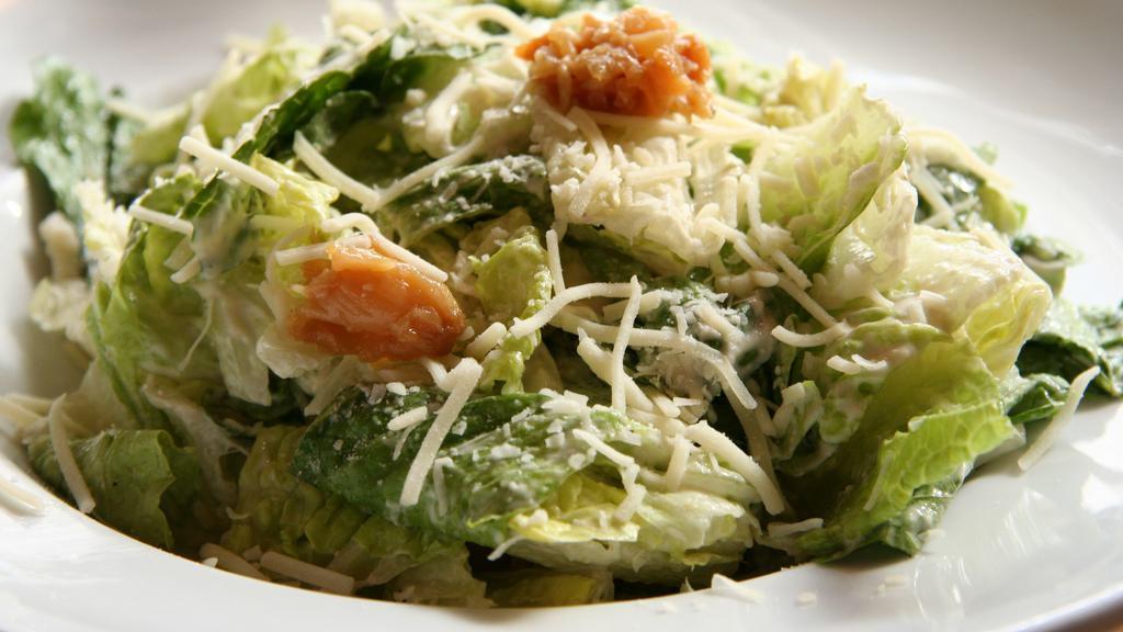 Caesar Salad · Romaine lettuce, asiago cheese, garlic croutons, housemade Caesar dressing.