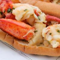 Naked Lobster Roll · Warm Maine lobster meat poached in butter, lemon and chive.