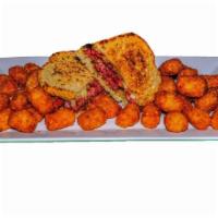 Corned Beef And Swiss · A generous portion of slow cooked, thick-cut corned beef, served on toasted rye with Swiss