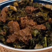 #18. Gomen Besiga · Mild beef stew, served served on regular injera with side of Ethiopian chess 'Ayeb'