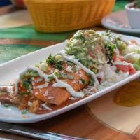 Mexicali Burrito · Choice of shredded chicken, ground beef, pork carnitas or barbacoa. Stuffed with rice and re...