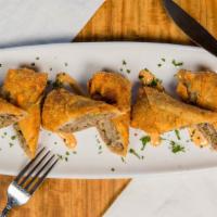 Prime Rib Egg Rolls · shaved prime rib, peppers, onions, provolone cheese, chipotle ranch