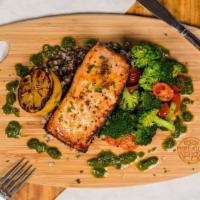 Cedar Plank Salmon · Gluten-free. Marinated cedar plank salmon, basil pesto, grilled lemon