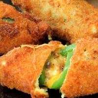 Jalapeno Poppers · Lightly breaded jalapeno peppers stuffed with cream cheese and served with horseradish sauce.
