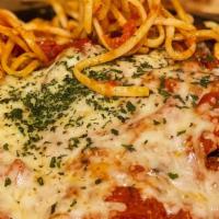 Eggplant Parmigiana · Lightly breaded and sautéed in olive oil and topped with marinara and melted mozzarella chee...