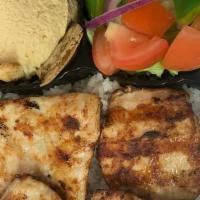 Chicken Kabob Platter · Marinated chicken served over rice with sides of hummus and salad.
gluten free