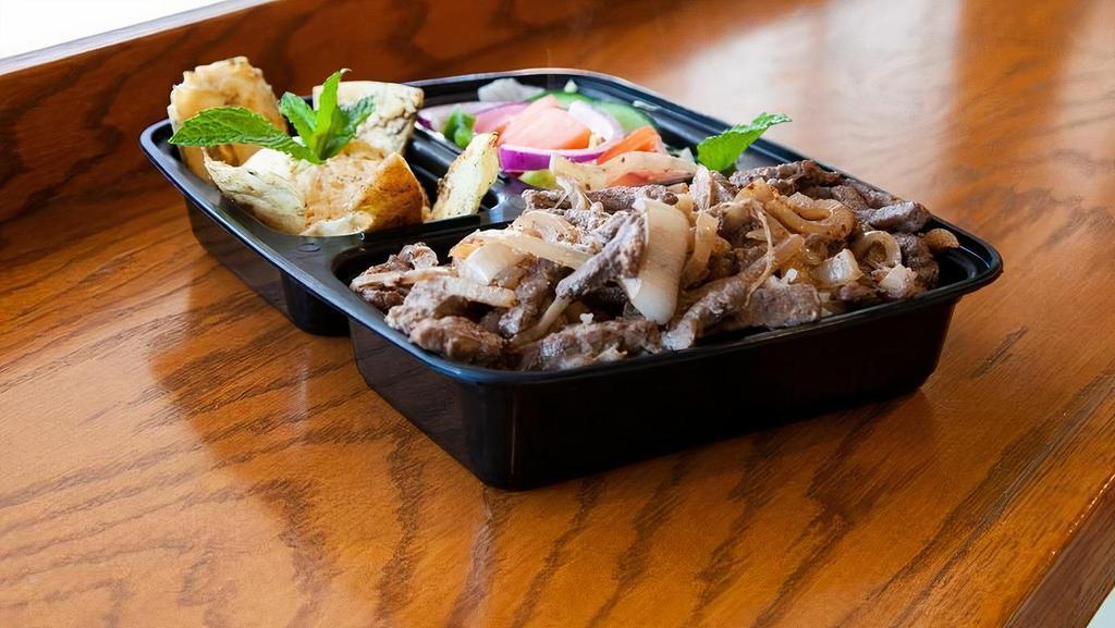 Beef Shawarma Platter · Marinated beef served over rice with a topping tahini sauce and sides of hummus and salad.gluten free
