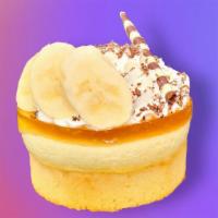 Banana Cream Torte · Vanilla cake layered with glazed bananas and banana custard. Topped with airy buttercream.