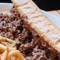 Philly Cheesesteak · thinly sliced ribeye. sautéed onions. cooper sharp american cheese. Served with fries.