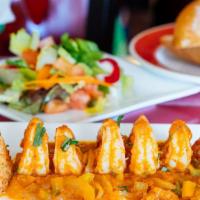 Camarones Enchilados · 6 jumbo shrimp with tomatoes, onions, green and red peppers sauteèd in a spicy chipotle sauc...