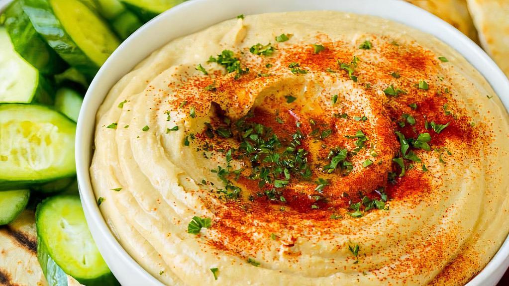 Hummus Dip (4 Oz) · Chickpea purée mixed with sesame oil served with toasted pita bread.