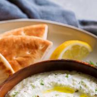 Tzatziki Dip (4Oz) · Greek yogurt and garlic sauce served with toasted pita bread.