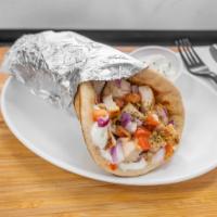 Chicken Gyro · Chopped grilled chicken, diced tomatoes and onions all wrapped in toasted pita bread with yo...