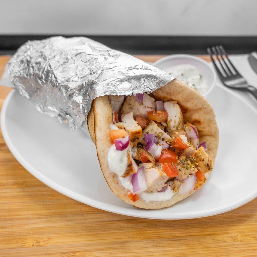 Chicken Gyro · Chopped grilled chicken, diced tomatoes and onions all wrapped in toasted pita bread with your choice of sauce.