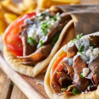Traditional Gyro(Beef&Lamb) · Gyro meat, diced tomatoes and onions all wrapped in toasted pita bread with your choice of s...