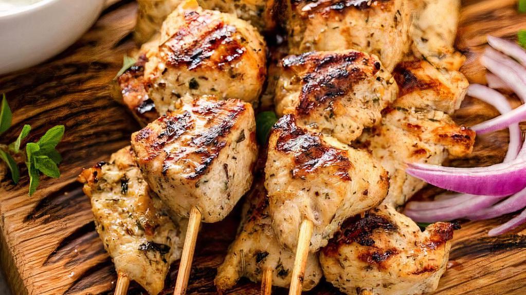 Souvlaki / Skewers · Chunks of tender pork or chicken on a skewer marinated with Greek spices and cooked to perfection. Served with toasted pita bread and your choice of sauce (2 skewers per serving).