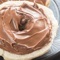 Toasted Bagel With Nutella · Toasted bagel of customer's choice on nutella.