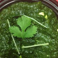 Palak Paneer · Gluten-free. Homemade cheese simmered with spinach, tomatoes, and exotic spices.