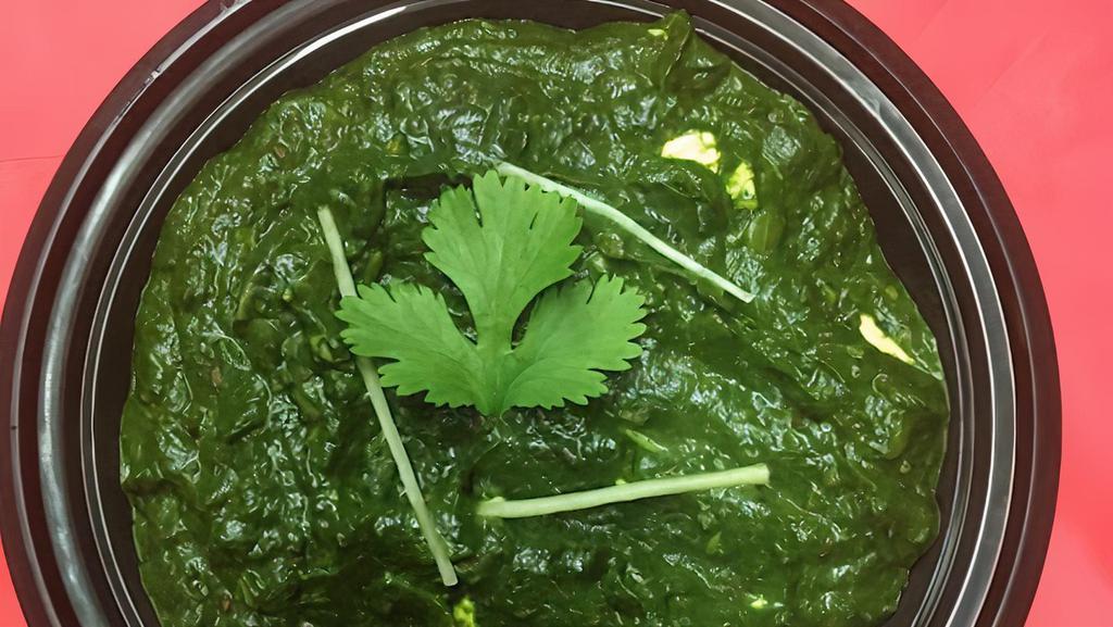 Palak Paneer · Gluten-free. Homemade cheese simmered with spinach, tomatoes, and exotic spices.