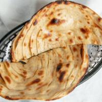 Lachha Paratha · Layered whole wheat buttered bread, served plain, recommended with daal bokhara.