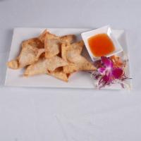 Fried Wonton (7) · Minced chicken and shrimp wrapped in wonton served with sweet chili sauce.