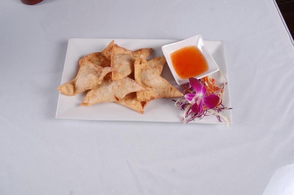 Fried Wonton (7) · Minced chicken and shrimp wrapped in wonton served with sweet chili sauce.