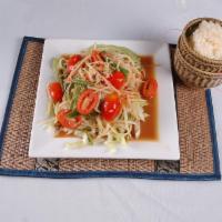 Papaya Salad · A unique blend of shredded papaya blended tomatoes, string beans, chili, and lime juice. Top...