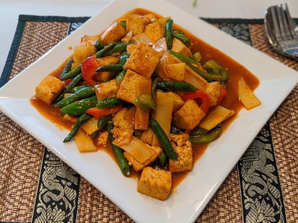 Spicy Tofu (Pad Pet Tofu) · Fried spicy tofu sauteed with fresh basil leaves, thai chili, and garlic.