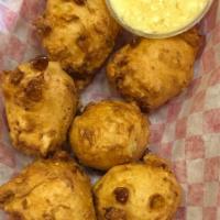 Sourdough’S Corn Fritters · Six pieces with honey butter.