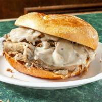 Roast Pork & Cheese · Slow-roasted thin-sliced Italian roast pork with aged sharp provolone cheese served on a fre...
