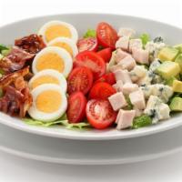 Cobb Salad · Fresh salad prepared with chopped romaine lettuce, tomato, crispy bacon, grilled chicken, bo...