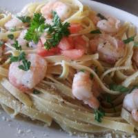 Shrimp Scampi · Large pieces of shrimp smothered in butter, garlic and wine sauce, served with freshly squee...