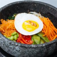 Bibimbap · Rice in a hot stone bowl topped with assorted vegetables & EGG. Comes with a choice of sauce...