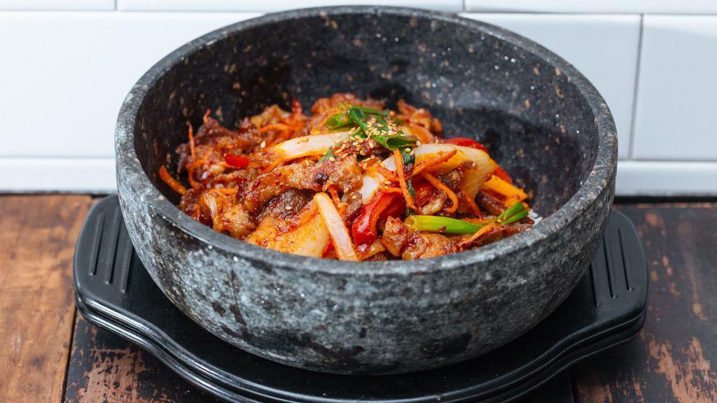 Spicy Pork Bowl · Grilled spicy pork WITH VEGETABLES over rice in a hot stone bowl.