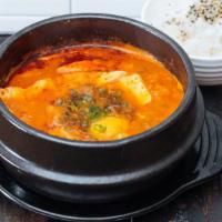 Soft Tofu Stew · Seafood, Kimchi & Pork.  Silken tofu stew with egg and seafood in bone broth.